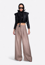 Model wearing women’s designer leather jacket, front-side view – East Vibe